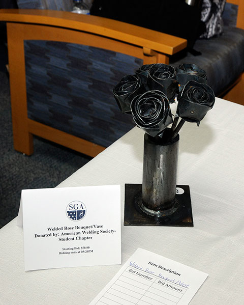 Blending art and academics, the student chapter of the American Welding Society offered this rose bouquet and vase.