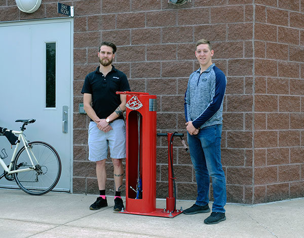 Devon DeVito (left), owner of The Bicycle Center, and Everett B. Appleby, 2018-19 Student Government Association president at Pennsylvania College of Technology, partnered to bring a freestanding bike repair station to campus.