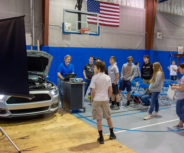 Jeffrey M. Januchowski, assistant professor of automotive technology (Ford ASSET), demonstrates a Mustang’s computer system and how it is used to diagnose problems.