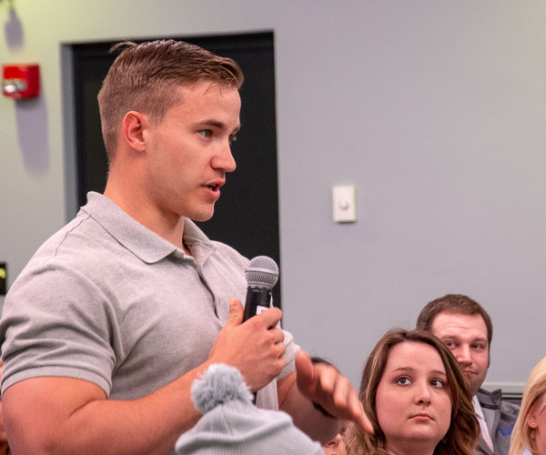 Residential construction technology and management student John A. Gondy, of Glenmoore, asks a question of panelists.