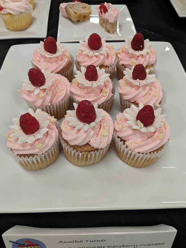 As part of a “Cupcake Wars” finale in the Cakes and Decorations course, Annika I. Turner, of Lewisburg, presents white chocolate raspberry cupcakes.