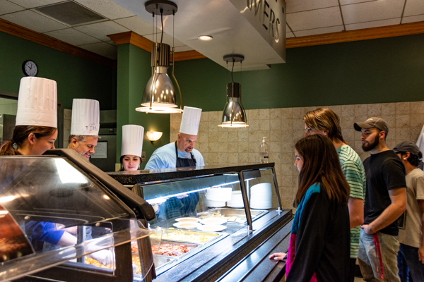 An all-star lineup of servers from Athletics and Residence Life keeps up with the hungry horde.