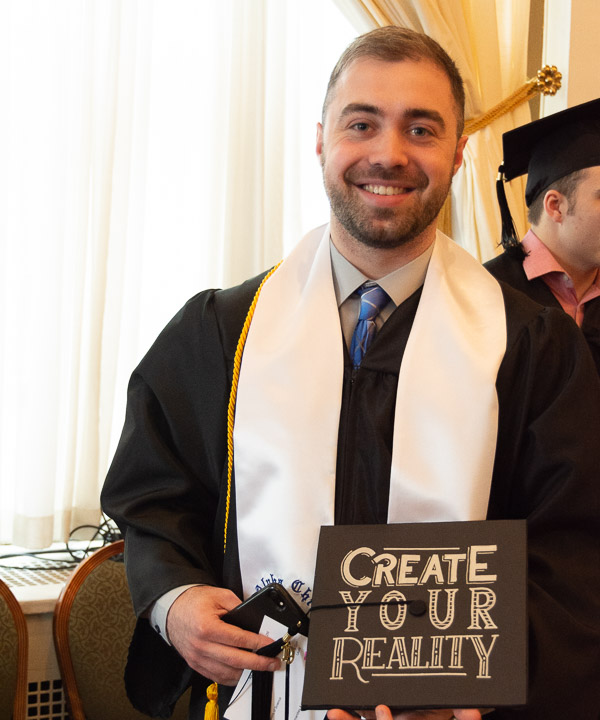 Already making a splash on the national graphic design scene, summa cum laude graduate Brandon M. Wolff added a bachelor's and the Academic Vice President and Provost's Award to his collection.