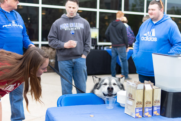 Welding instructor Timothy S. Turnbach's malamute, Smokey, eyes water and treats ...