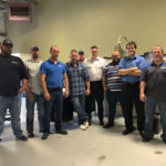 Assembling for a group photo during training in Agawam, Mass., are (from left) welding instructors Aaron E. Biddle and Ty E. Rhinehart; James N. Colton, assistant professor of welding; welding instructors Ryan P. Good and Jacob B. Holland; Tony Slater, technical sales manager, Cambridge Vacuum Engineering; CVE field engineers Jorge Alvarez and Daniel Rosania; and Michael R. Allen, welding instructor. 