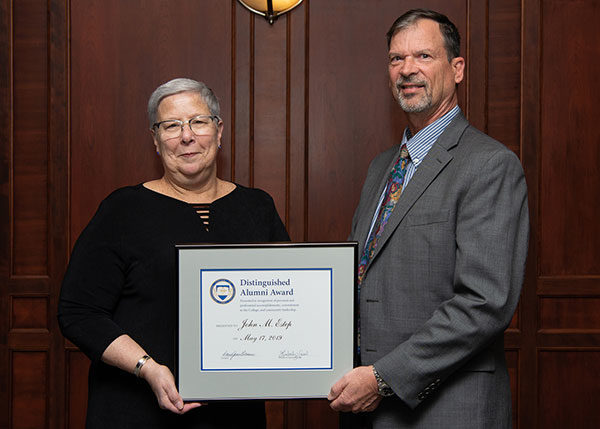Penn College President Davie Jane Gilmour presented the Distinguished Alumnus Award to John Estep, of Troy, a 1974 mechanical drafting graduate of Penn College’s predecessor institution Williamsport Area Community College. 