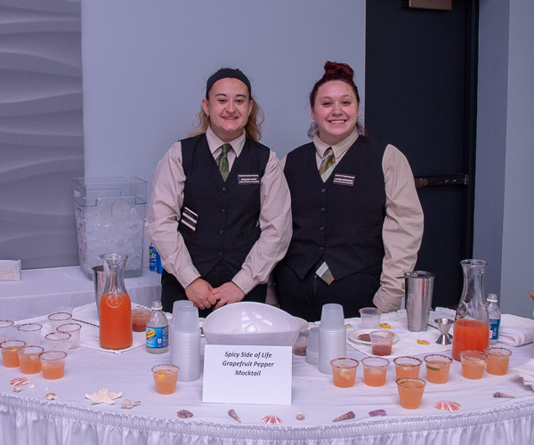 Chelsea L. Gray, of Marysville, left, and Lauren N. Meszaros, of Starrucca, stand ready to serve their “Spicy Side of Life” grapefruit pepper beverage.