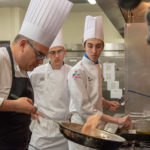 Students Jacob W. Parobek, of Seltzer (center), and Kobi A. Shannon, of Lewistown, observe Santodonato.
