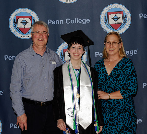 Joining alumni parents Michael J. (a faculty member with three welding-related degrees) and Laurie A. (forest technology), Victoria L. Nau prepares to claim her bachelor's in health information management (magna cum laude) and an associate degree in health information technology (with high honors).