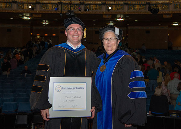  President Gilmour presented David S. Richards, professor of physics, with an Excellence in Teaching Award.