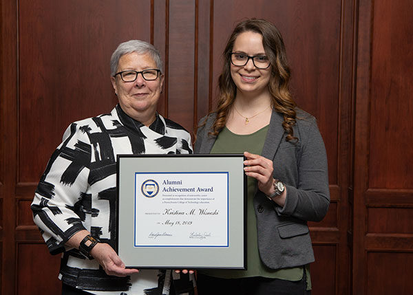 President Gilmour presented the Alumni Achievement Award to Kristina Wisneski, of Admore, a 2013 culinary arts and systems graduate.