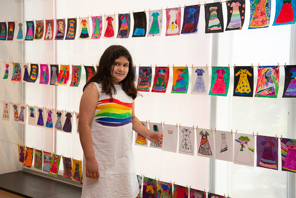 Louise Surujbally shows her print that served as the foundation for her new dress. Surujbally just completed third grade at Cochran Primary School. 