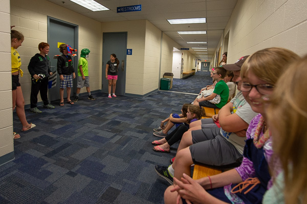Youngsters delight in a camp-concluding fashion show, held in a Campus Center hallway conveniently between two restrooms (for quick costume changes).