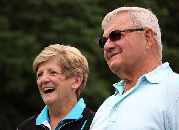 Linda and Ed Alberts, of Ralph S. Alberts Co. Inc., don't let rain spoil their good time.