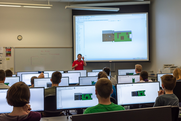 Craig A. Miller, instructor of engineering design technology, engages campers in a CAL classroom.