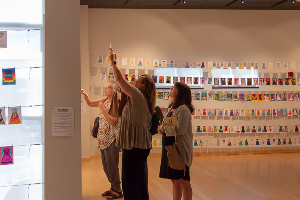 Visitors delight in the engaging exhibit.