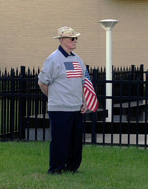 Dr. Joseph English, a Navy veteran and longtime local physician, honors the flag outside the SASC. English and DiSalvo, friends since their teens, are the only two local Eagle Scouts to receive national distinction.