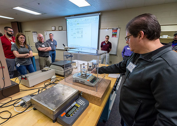 Patrick White, of Thermo Fisher Scientific in Millersburg, performs a hands-on exercise during a Plastics Materials, Processing and Testing workshop at Pennsylvania College of Technology.