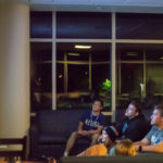 After a day of icebreakers and information, Connections guests unwind with a video game in the lounge.