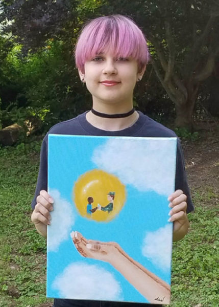Audrey Bodnar, winner of the grades K-6 category in the Helping Hands/Healing Hands Art Challenge, with her work, “Warmth.”