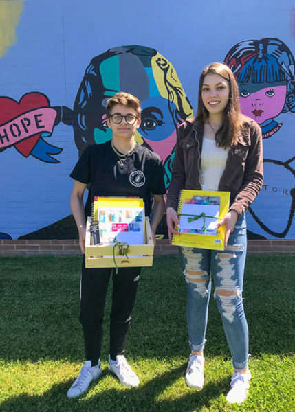 Olivia Gautieri (left) and Rose Wascher, recognized in the grades 7-12 category in the Helping Hands/Healing Hands Art Challenge, display their art-supply prizes.