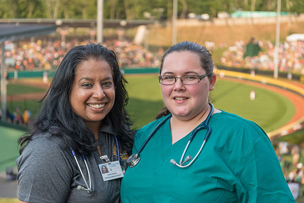 Kavitha R. Kolangaden and Jaclyn L. Casey, who graduated from Pennsylvania College of Technology with degrees in physician assistant in 2018, volunteer at the 2017 Little League Baseball World Series. Thirty-two Penn College students pursuing careers as paramedics and physician assistants will help provide health care at the 2019 LLWS.