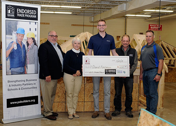 David J. Foreman (center), of Duncansville, is presented with an Outstanding Student Award by (from left) David DiPasquale, the Pennsylvania Builders Association's director of endorsed programs; Carroll Pawlikowski, executive officer of the West Branch Susquehanna Builders Association, and Penn College instructors Barney A. Kahn IV and Levon A. Whitmyer.