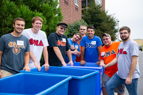 Brothers of the blue bin brigade! Phi Mu Delta fraternity members put their service values to work. 