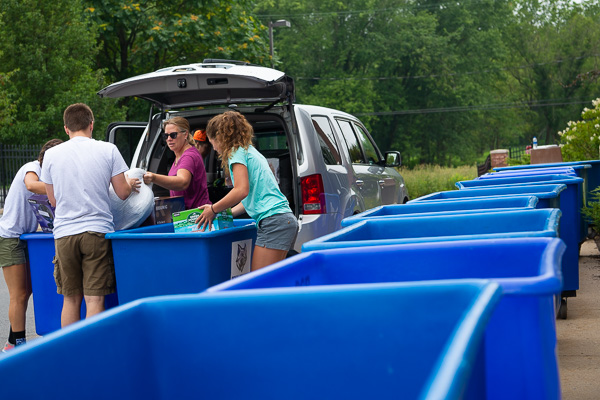 A sea of blue bins awaits the day's portable accumulation of items from home.