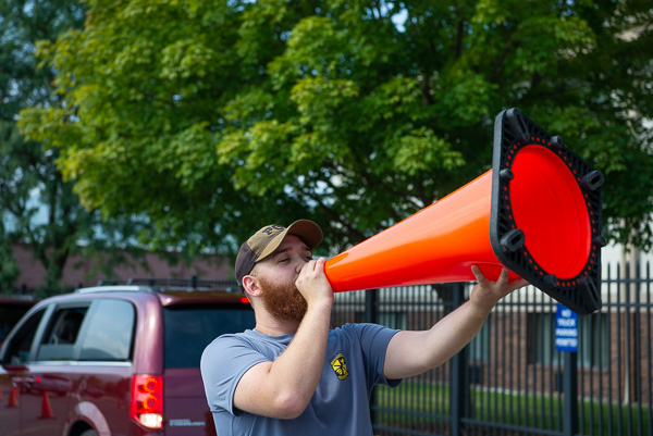 Construction cone-turned-megaphone: Zarek L. Price shouts directions (and a hearty Penn College welcome). Price, of Port Allegany, is enrolled in building science and sustainable design: architectural technology concentration.