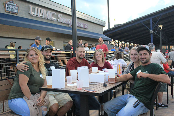 Gathered for game-night refreshment – and scoring some boxed bobblehead giveaways inspired by local NBA draftee Alize Johnson – are (from left)Meghan M. Stabley ('16, health information management), Joshua A. Latterner ('11, civil engineering technology), Ryan P. ('12, civil engineering) and Brittany J. Smith ('17, health information management), and Abigail M. Gesselman ('16, physician assistant) and Travis M. Portzline ('11, surveying technology).