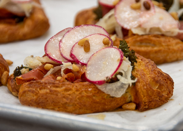 While traditionally a breakfast pastry, Niedermyer introduced some savory preparations and ingredients to help bakers expand their pastry line to lunch. This one features kale, radishes and other veggies.