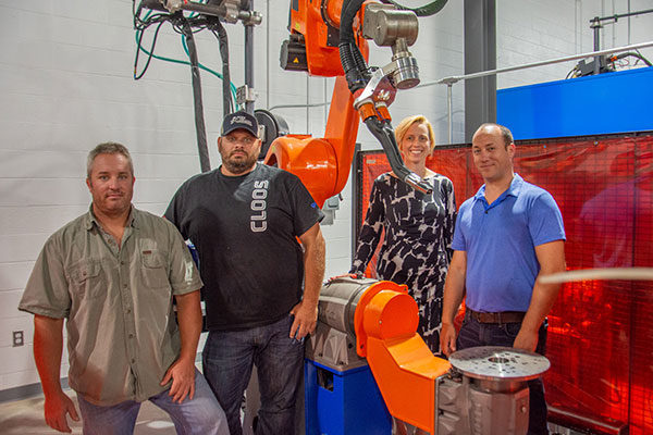 CLOOS Robotic Welding has entrusted a QRC 320 upright robot with V9 controller to Pennsylvania College of Technology. With the equipment in the college’s welding lab are, from left, Ryan P. Good, assistant professor of welding; Aaron E. Biddle, instructor of welding; Elizabeth A. Biddle, director of corporate relations; and James N. Colton, assistant professor of welding.