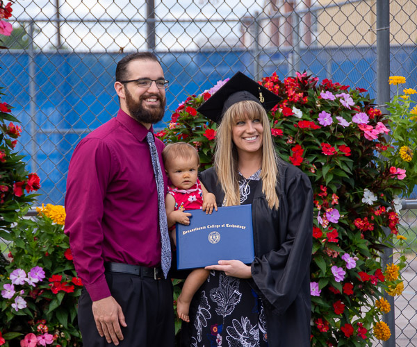 Bethany D. Schantz, of Northumberland, celebrates with her husband and daughter, who is ready to seize a degree of her own. Schantz has earned three degrees from Penn College: associate degrees in health arts: practical nursing emphasis (2011) and nursing (2016) and a bachelor’s degree in nursing (2019).
