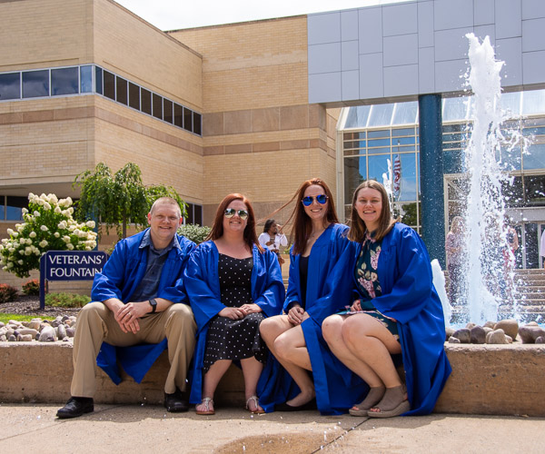 Radiography graduates gather in front of the Advanced Technology and Health Sciences center, where they spent significant time honing their skills.