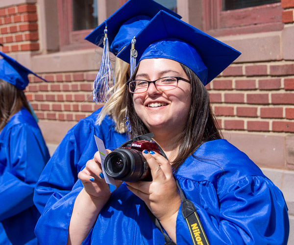 Rachel A. Eirmann, an individual studies graduate from Bellefonte and a former student photographer for the college, naturally brings her camera on the commencement adventure.