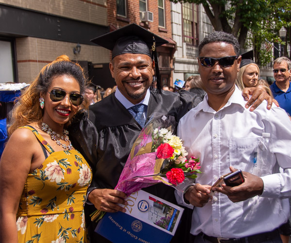 Michael Adera, a physician assistant grad from Bowie, Md., shares the occasion with family.
