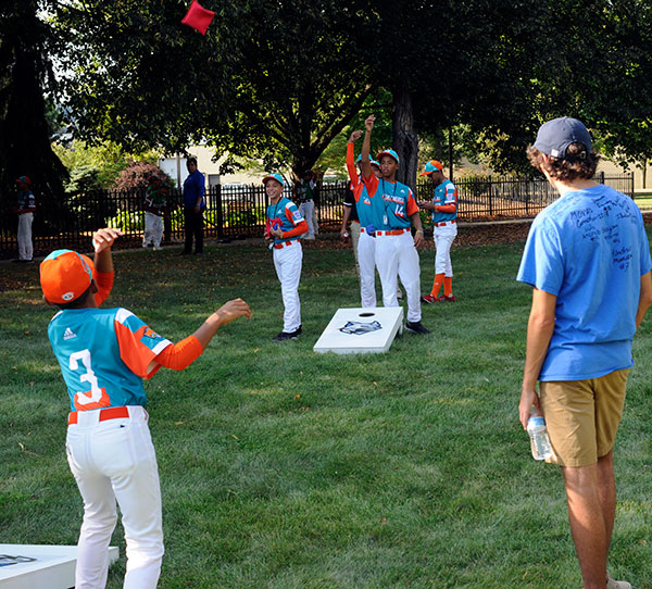 Patrick C. Ferguson, of Williamsport, president of the college's Student Government Association, supervises a game of cornhole involving his assigned Latin America team from Maracaibo, Venezuela.