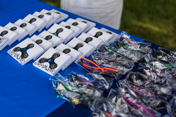 The swag table is stocked with fidget spinners and sunglasses ...