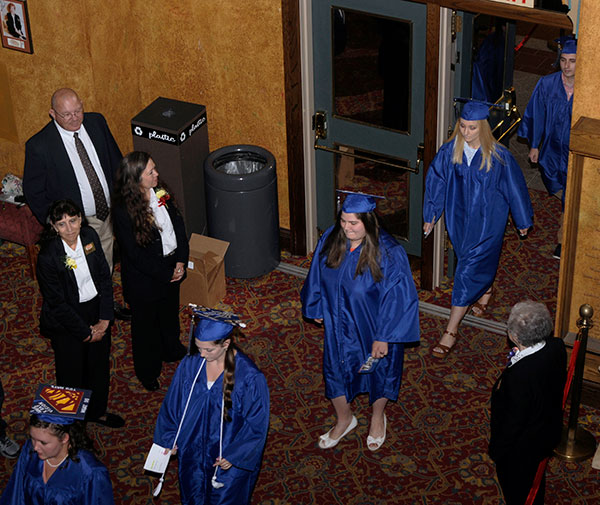 Soon-to-be-grads ride a wave of anticipation, achievement and contemplation across the CAC foyer.