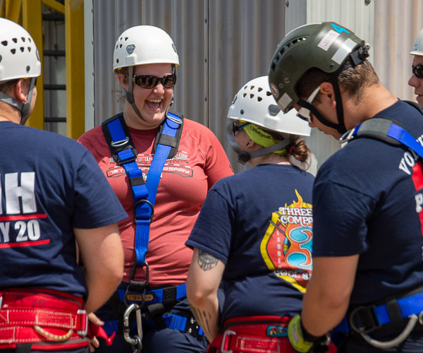 Sarah C. Gagnon, a paramedic technician student from Morris, shares a laugh with her peers at the CAFCA site.