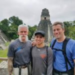 Graphic design student Joey Morrin joins Curt E. Vander Vere, assistant professor of mathematics, left, and D. Robert Cooley, associate professor of anthropology/environmental science, in front of a Maya temple in Guatemala’s Tikal National Park. Known as the Temple of the Great Jaguar, it was constructed around A.D. 732.