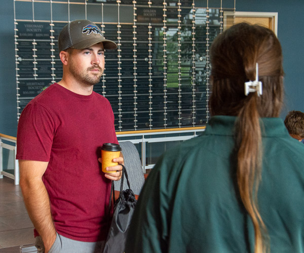 During a casual breakfast before the Veterans Success Program’s informational sessions, student Matthew R. Pondel, a first-year student in surveying technology, talks with Gina M. Peluzzo, a senior in civil engineering technology and a veterans services assistant.