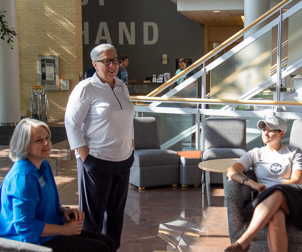 President Gilmour (center) greets new students in the School of Nursing & Health Sciences on Sunday. With her are Sandra L. Richmond (left), dean of the school, and pre-dental hygiene student Ashley N. Thoirs-Lawrence.