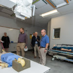 Back to his roots, Cutler visits the radiography lab to hear about advances in technologies from Christine L. Eckenrod, the college’s new director of radiography. 