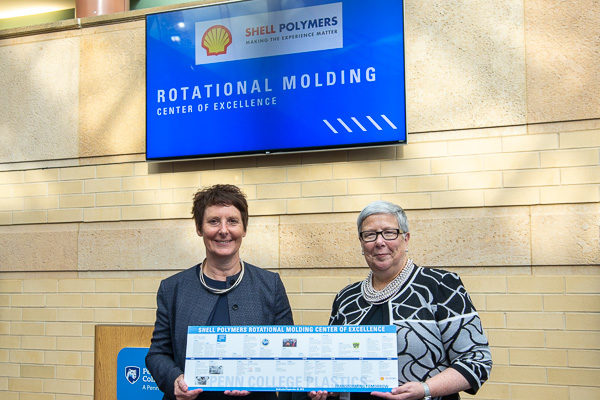 Pennsylvania College of Technology President Davie Jane Gilmour (right) presents a timeline of the college’s plastics program – capped with Shell Polymers’ funding of the Shell Polymers Rotational Molding Center of Excellence – to Hilary Mercer, vice president, Pennsylvania Chemicals, for Shell. The center was dedicated in ceremonies taking place Sept. 24.