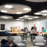 Schwenk and Barbara J. Albert, director of the Children's Learning Center – whose husband, Eric K., is an associate professor of machine tool technology – talk with a student among the evening's attendees.