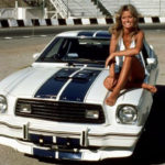 In one of many cultural touchpoints featuring the Mustang, Farrah Fawcett sits atop a 1976 Cobra II during her "Charlie's Angels" years. (Others cited in the presentation include Steve McQueen's famed San Francisco car chase in 1968's "Bullitt.")