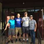 Wrestlers gather at the entrance to Pine Street United Methodist Church in downtown Williamsport, site of the weekend book sale.