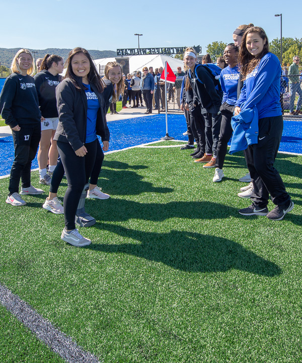 Cheesing for the camera before the formal dedication ceremony are members of the women’s soccer team, who formed a path through which recognized partners entered the field. 